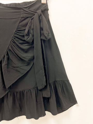 Falda negra lazada Dravita